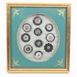 Buttons - a fine framed display of ten 18th Century steel buttons, mostly with cut decoration some