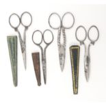 Four pairs of steel scissors including a button holing pair, one pair by Joseph Rodgers, another