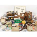 A mixed lot sewing comprising darners, wooden shuttles, needle books, wicker sewing pannier etc