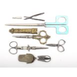A collection of scissors comprising a pair of dressing table scissors with blue enamel handles, 24.