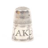 An attractive late 18th century English silver thimble, the frieze with rectangular cartouche boldly
