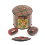 Tartan ware - sewing - four pieces, comprising a metal shuttle (McDuff), 7cm, a double ended