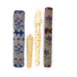 Four needle cases comprising two beadwork covered examples with minor losses, largest 9.2cm, a