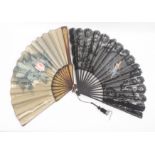 Three early 20th Century fans, comprising a white ostrich folding fan with tortoiseshell guards