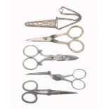 Four pairs of scissors comprising a pair with silver handles the blades stamped for 'T. Turner and