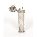 An early 19th Century continental engraved silver etui of oval section and tapering form engraved