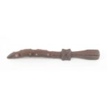 A Welsh mahogany knitting stick, curved carved blade to a square knop initialled and dated 'AK -