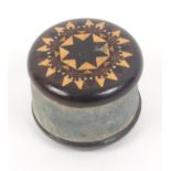 A Tunbridge ware rosewood circular sewing weight, the ends in stickware divided by faded blue