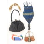 Purses and bags comprising a knitted miser's purse with carved ivory rings and tassels, 28cm, a