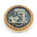 Button - a fine 18th Century button decorated with seed pearls, as a cherub by an elaborate