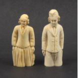 Two 19th century ivory Dieppe figural needle cases each of a fisherman in traditional costume, one