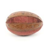 A mid 19th Century continental sewing companion of rugger ball form in alternate panels of red
