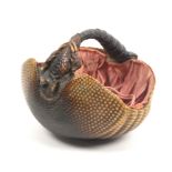 A Victorian sewing basket formed from an armadillo, silk lining with drawstring, 20cm