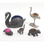 Five cast soft metal animal form pin cushions comprising a swan with hinged body, 14.5cm, a cat, 4.