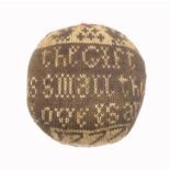 An 18th Century dated and inscribed knitted pin ball in brown and cream one side with two birds