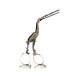 A pair of 19th century Dutch silver ribbon scissors cast as a stork, opening to reveal a fish in its