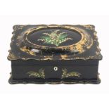 A mid Victorian papier Mache sewing box of rectangular form the black ground decorated in gilt,