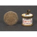 An unusual late 18th Century English enamel miniature tea caddy presumably for a doll, of oval form,