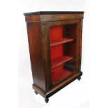 A late Victorian walnut and inlaid pier cabinet enclosed by a single glazed door, gilt metal