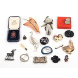 A mixed lot brooches and similar items comprising a continental silver brooch of a stag, 5.5cm, a