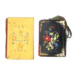 Two needle books comprising a gilt metal souvenir style example the covers with colour inlays,