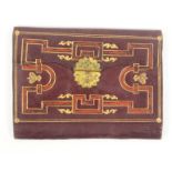 A mid 19th Century maroon leather rectangular purse/ wallet, with elaborate gilt tooling and