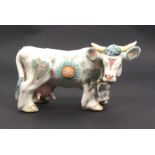 A Basil Matthews ceramic figure, of a floral decorated standing bull inscribed 'Basil Matthews -