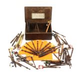 A lace bobbin box and a selection of lace bobbins, the rectangular oak box pin initialled and