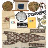 A quantity of needleworks, white work trimmings, material pieces and a feather fan, linen etc (qty)