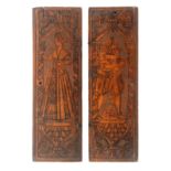 A pair of 17th or 18th Century cedar wood figural panels, probably internal lids from a box, one