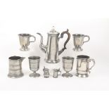 Nine pieces of pewter and similar wares, comprising a pair of pedestal pint goblets, 12.5cm, a