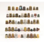 A quantity of brass and other metal thimbles including children's examples (qty)