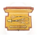 A fine French etui with parcel-gilt silver tools, in red leather- covered case with incut corners,
