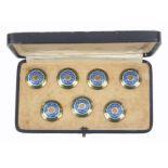 Buttons - a cased set of seven, continental silver gilt and enamel decorated buttons, circa. 1890,