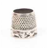 A late 17th century or early 18th century Dutch silver open top thimble the frieze cast with a