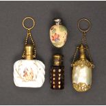 Four late 19th Century/early 20th Century scent bottles, comprising a ruby glass example of