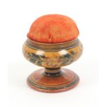 An early painted Tunbridge ware whitewood pedestal pin cushion, with floral and line painted