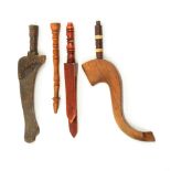 Four wooden knitting sheaths and sticks comprising a Dent Dale sheath with carved decoration,