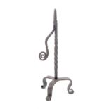 A 17th Century wrought iron rush nip, spiral twist stem with scrolling terminal to arm, on tripod