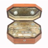An attractive Palais Royal satinwood sewing box, circa 1835, of elongated octagonal form, the