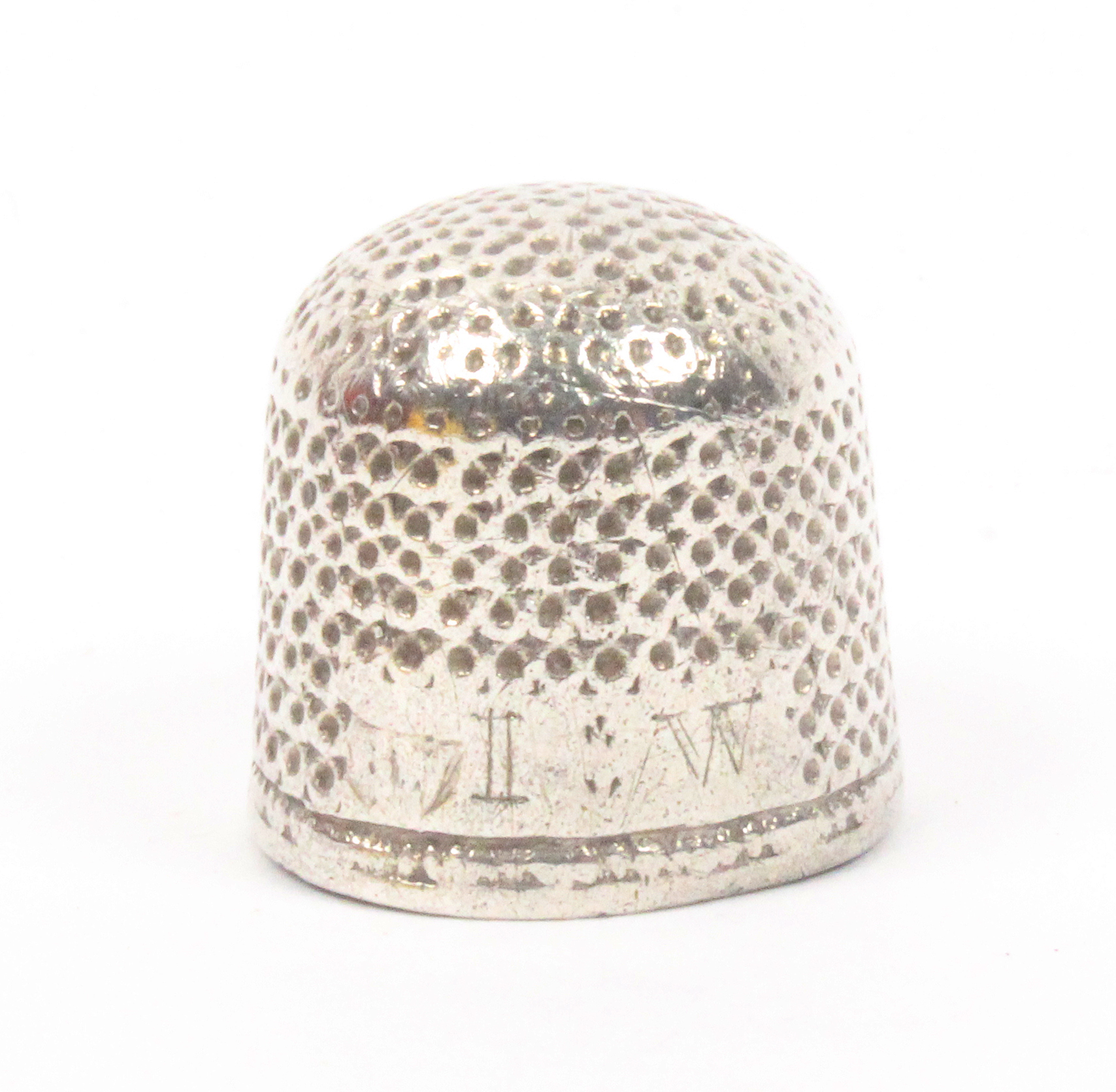 A late 17th century English silver thimble of good gauge the rectangular plain tablet initialled '