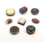 Eight pin cushions and emeries comprising four disc form examples two in ebony, another wooden