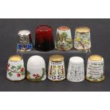 Nine thimbles comprising six modern enamels, a Royal Doulton flambŽ thimble, a modern Meissen