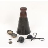 A group of metal items, comprising a primitive brass bell with later wooden handle, 16cm high, a