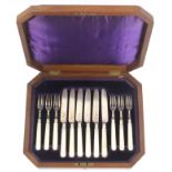 A set of six silver fruit knives and forks, with mother of pearl handles, Sheffield 1901, in a