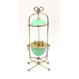 A mid 19th Century green glass and gilt metal mounted sewing companion in the form of an egg, the