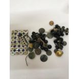 A comprehensive collection of buttons, buckles and similar items comprising four ring binders of