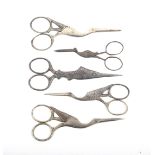 Five pairs of 19th century steel scissors comprising a pair in the form of a fish, 11.5cm, and