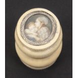 An early 19th Century French oval ivory box, the cover inset with a painted panel of a young girl