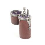 A leather cased tambouring or crochet set, the brown leather cylinder case with steel mounts the